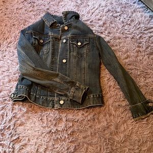 This is a Gap Jean jacket, made with 98% cotton and 2% spandex.